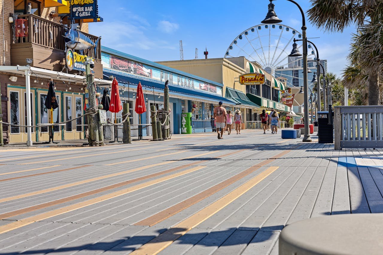 downtown myrtle beach people are walking in the morning time stores streetlights