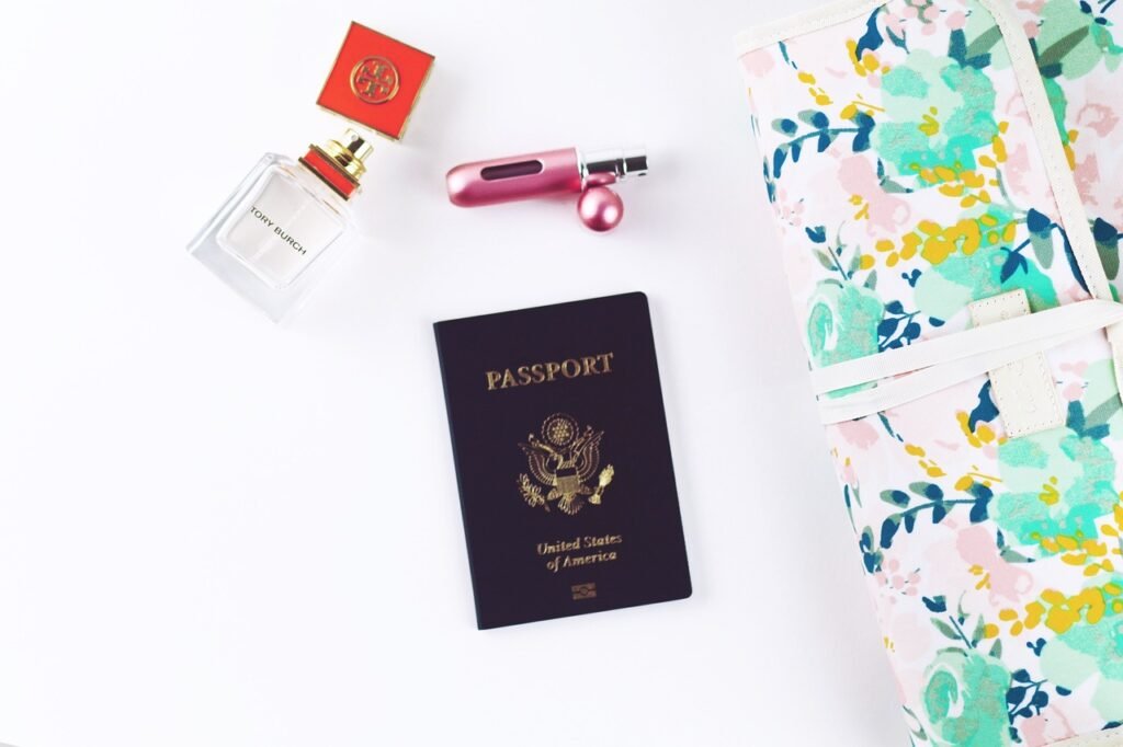 travel passport perfume beauty white desk representing can you travel with an expired passport