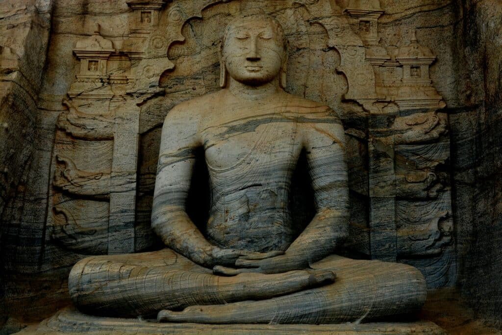 A serene ancient Buddha statue carved in stone at Gal Vihara Sri Lanka showcasing historic Buddhist art