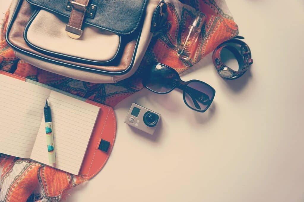 go pro pen notepad travel vacation journal diary bag accessories holiday flat lay travel travel travel travel travel vacation accessories